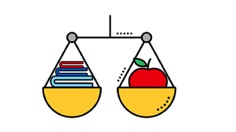 weight scale with books left and an apple on the right